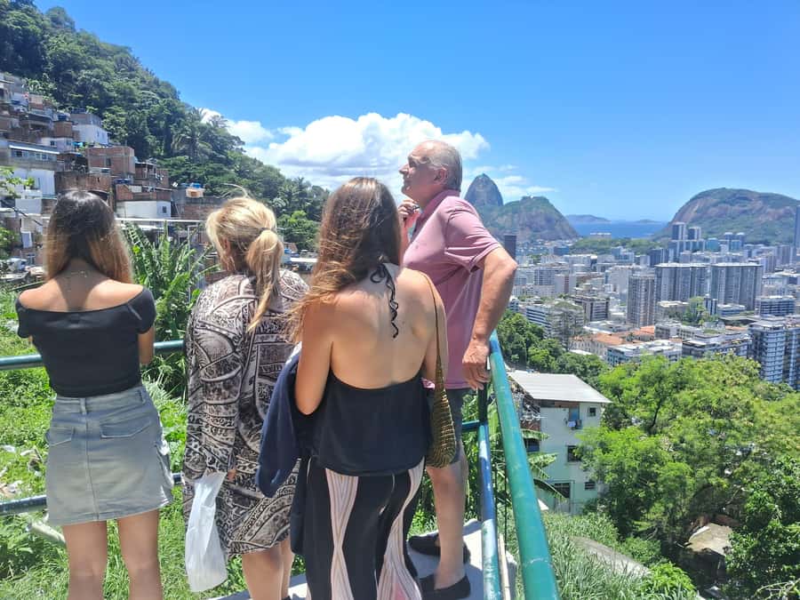 Favela Santa Marta: Walking Tour with local guide - Getting to Dona Marta: funicular up, then a street-level reality check